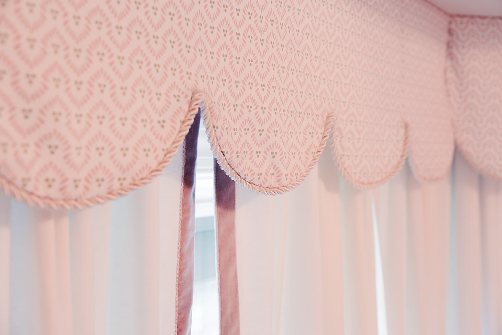 Storybook-26 Romantic pink window treatment with scalloped edges and delicate patterned fabric