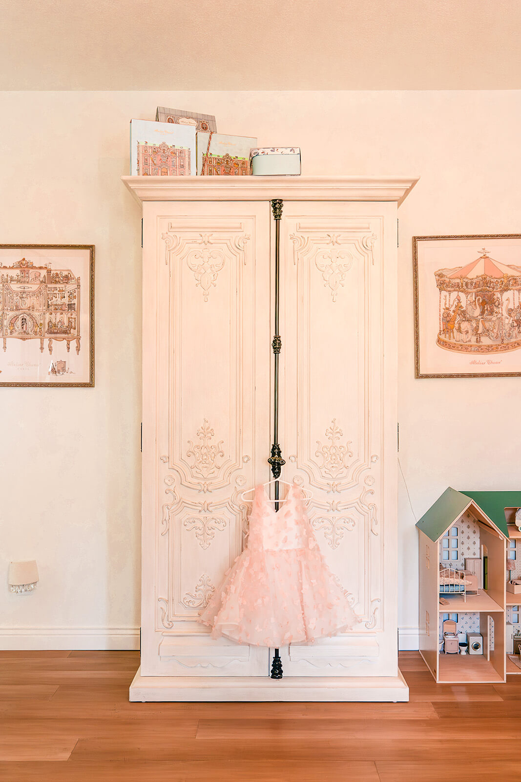 Storybook-32 Elegant wardrobe with framed artwork and refined decorative details in a soft neutral bedroom
