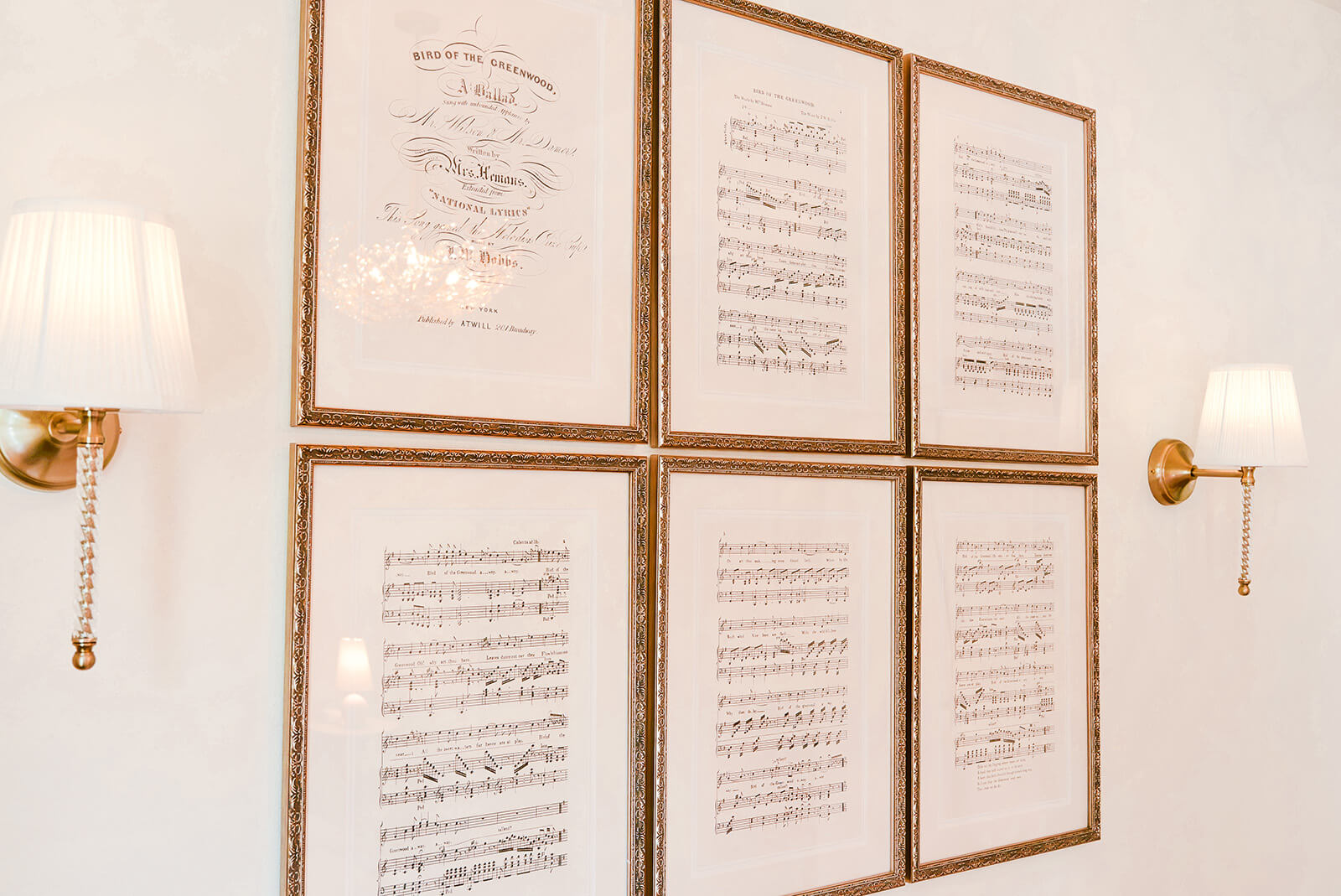 Storybook-33 Curated gallery wall featuring delicate framed artwork arranged above a refined bedroom dresser