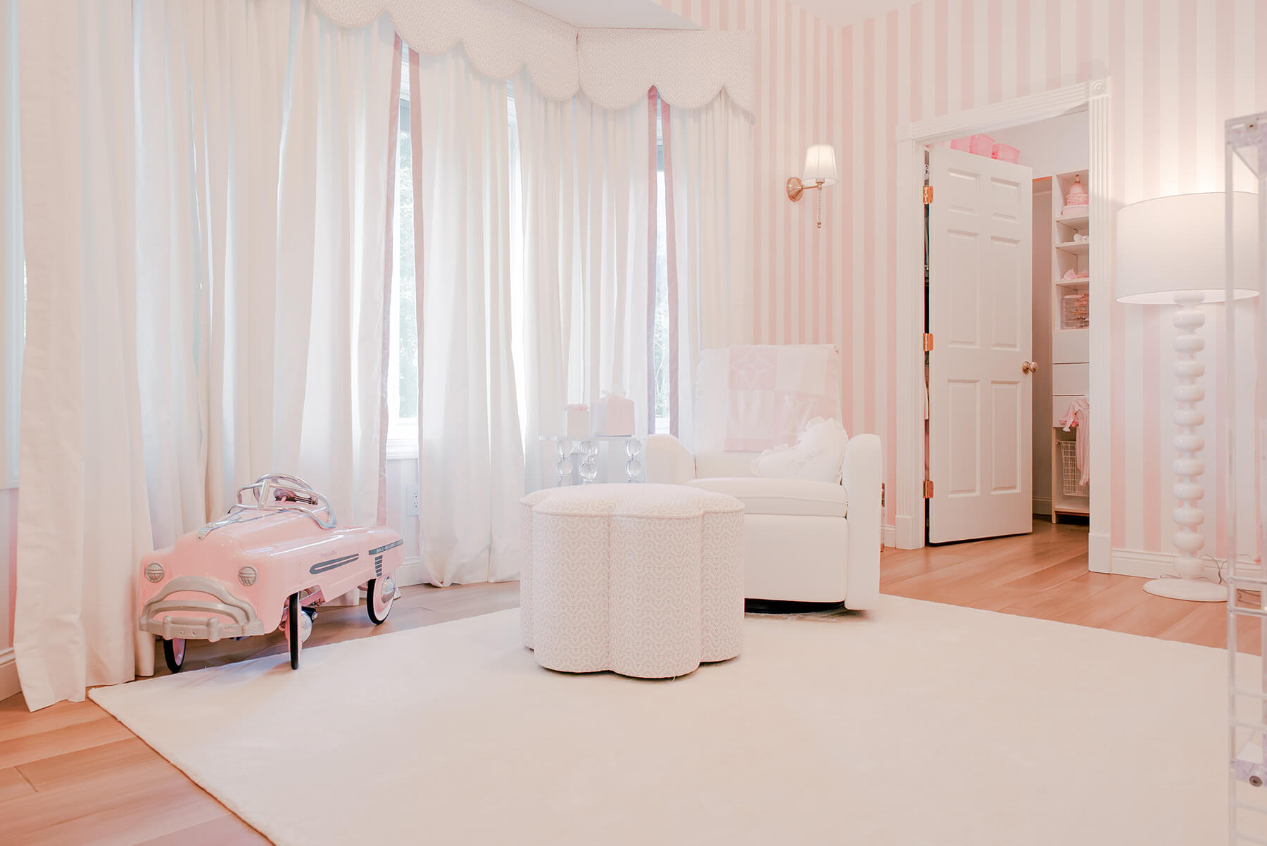 Storybook-4 Airy nursery with white furnishings, pink accents, sheer curtains, and a soft feminine aesthetic