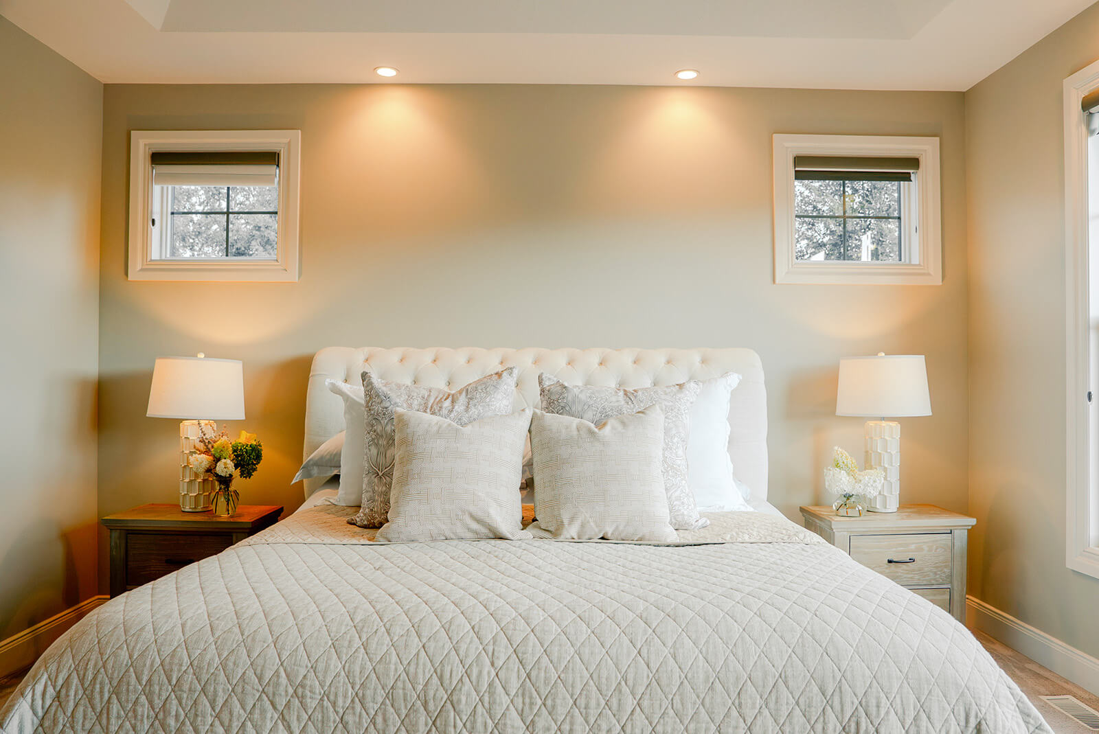 taylor-jane-project-4 Bright bedroom with crisp white bedding, soft neutral accents, and warm recessed lighting