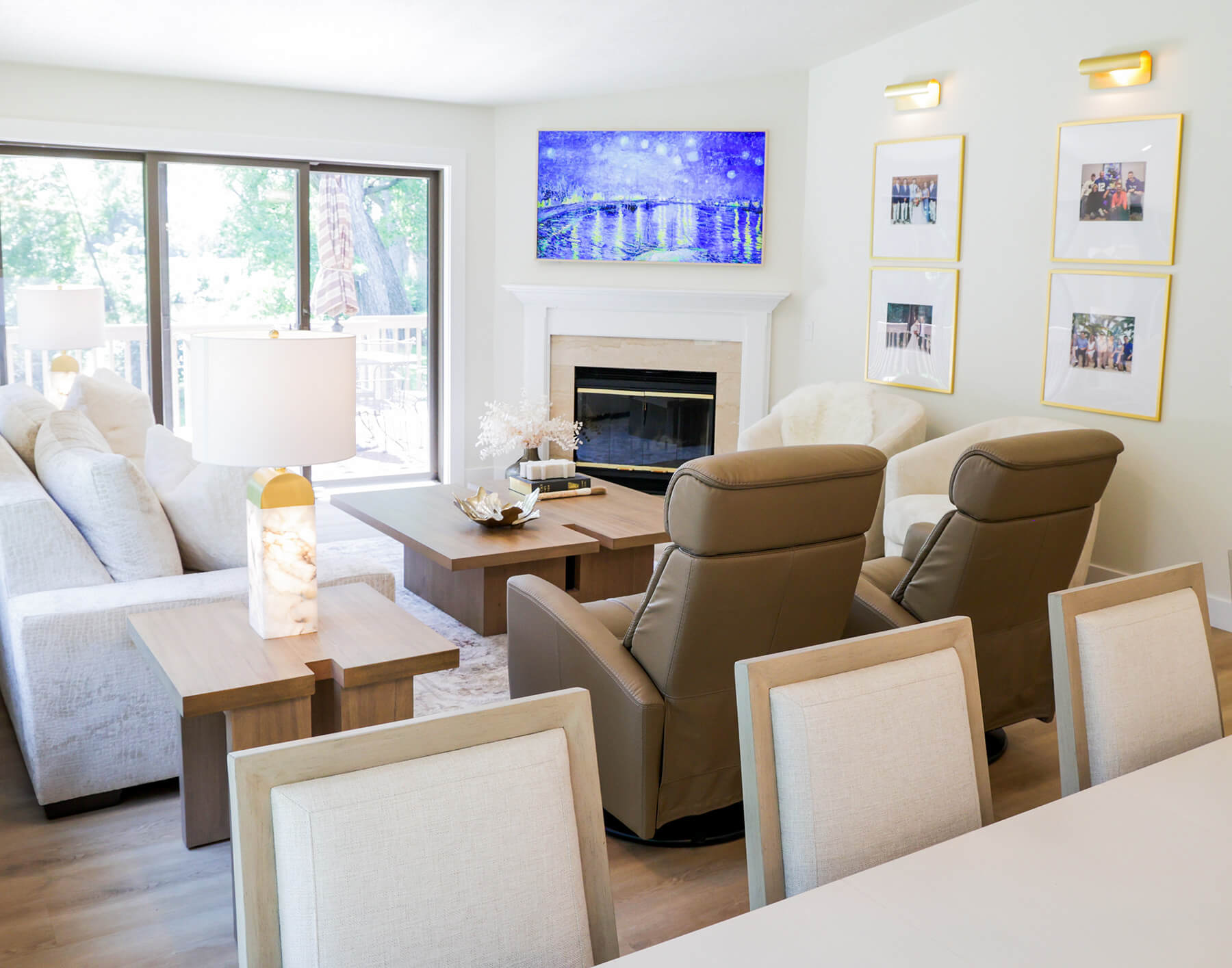 the-fairway-project-15 Bright, inviting living room with fireplace, natural wood tables, and layered seating