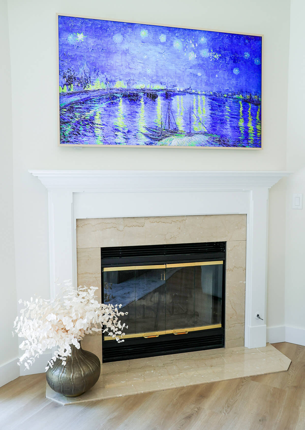 the-fairway-project-18 Elegant tiled fireplace with white mantel and framed TV