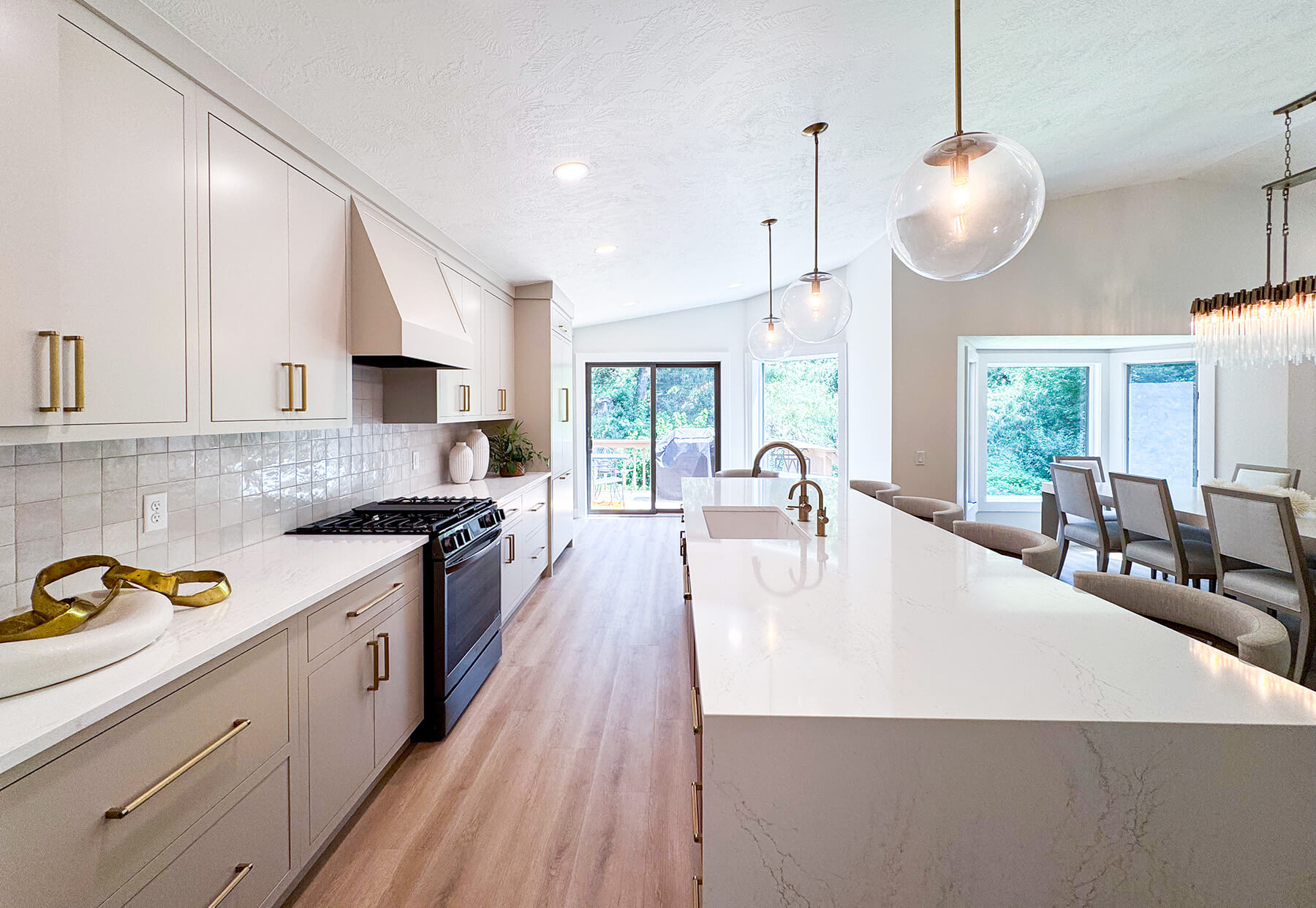 the-fairway-project-19 Bright white kitchen with custom cabinetry, gold hardware, and farmhouse sink