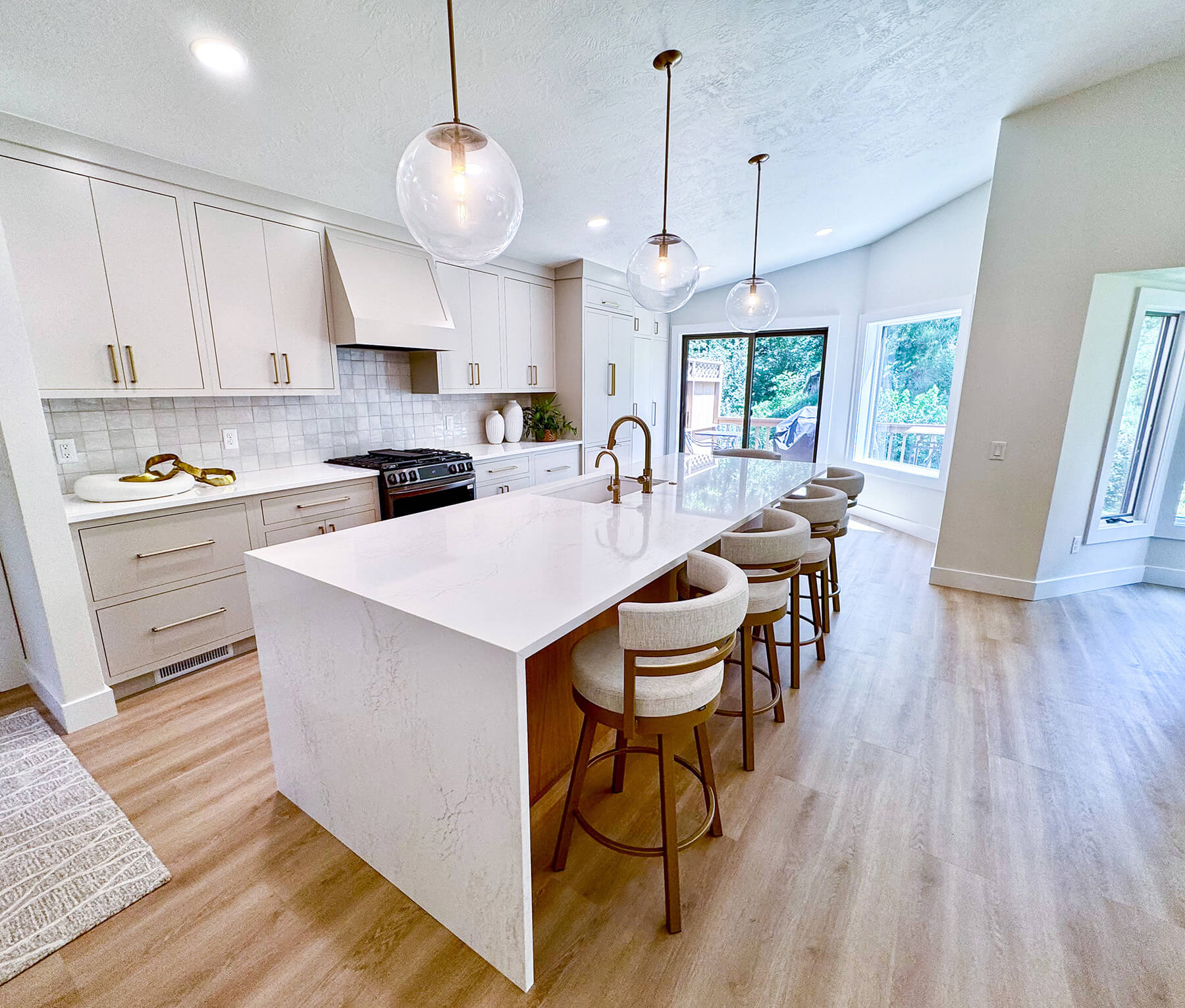 the-fairway-project-2 Modern white kitchen with gold hardware and custom finishes in a Sioux Falls home