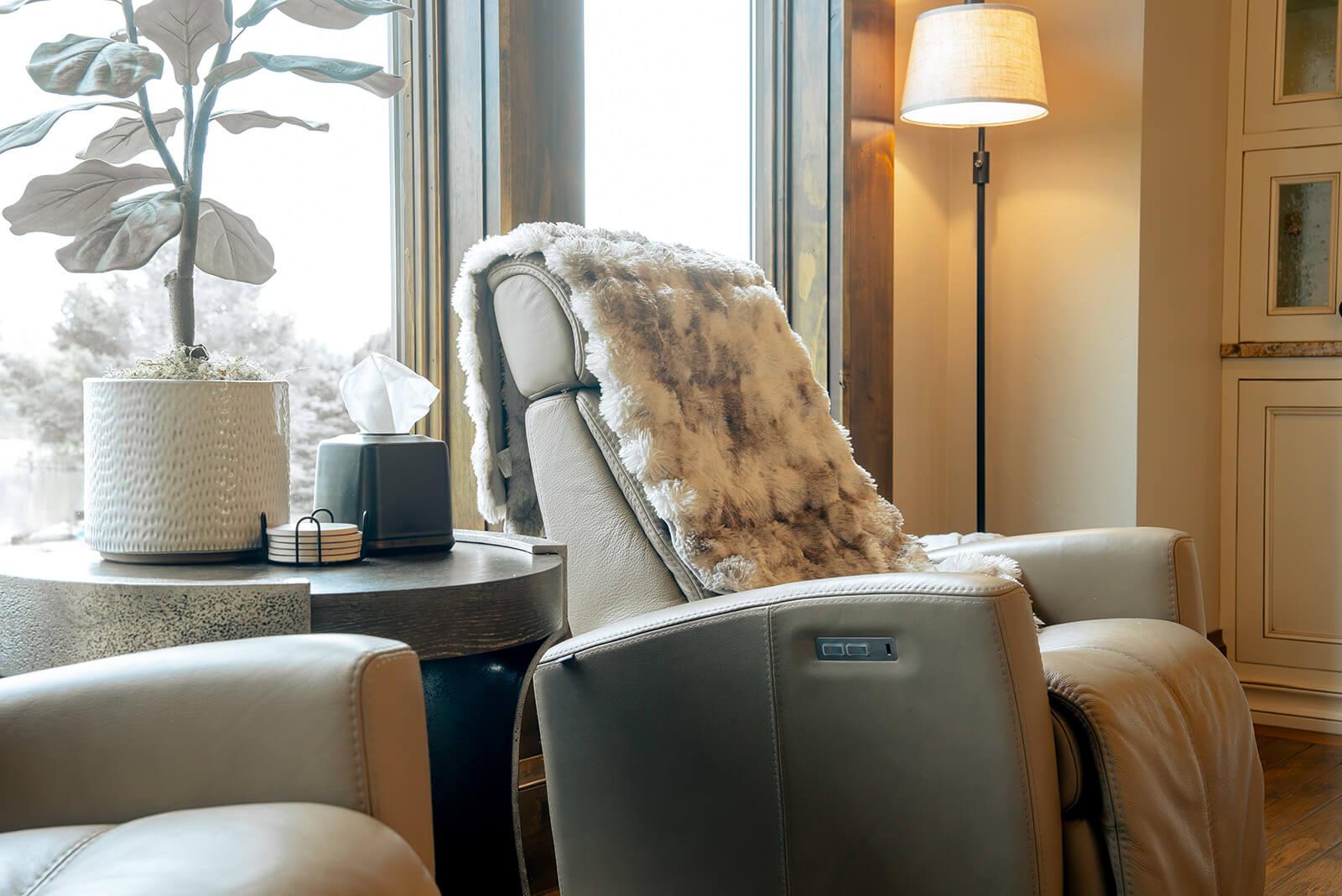 the-hearth-project-2 Cozy reading chair beside a window with soft natural light and layered neutral textures