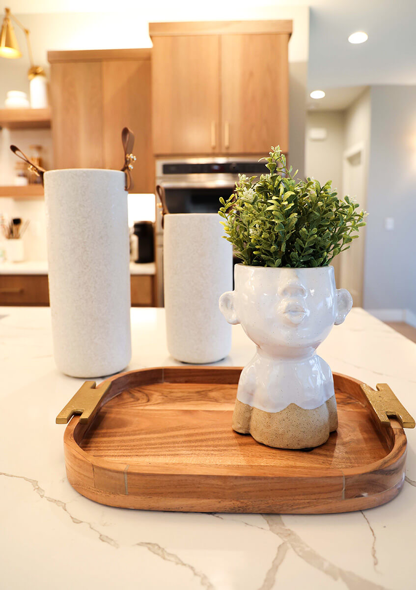 companion-project-2 Decorative tray with ceramic vase and candle on a wood console table