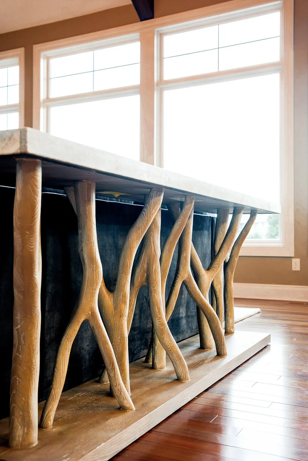 taylor-jane-project-41 Rustic branch-inspired console table with sculptural wood details creating an organic focal point behind the sofa