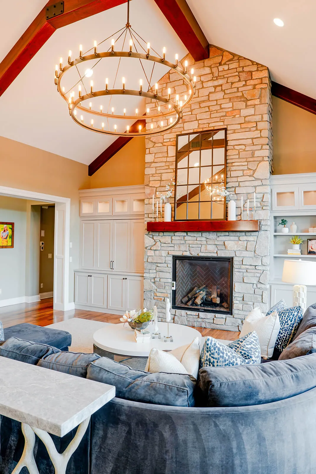 taylor-jane-project-42 Inviting seating area surrounding a stone fireplace, with white built-in cabinetry providing refined storage