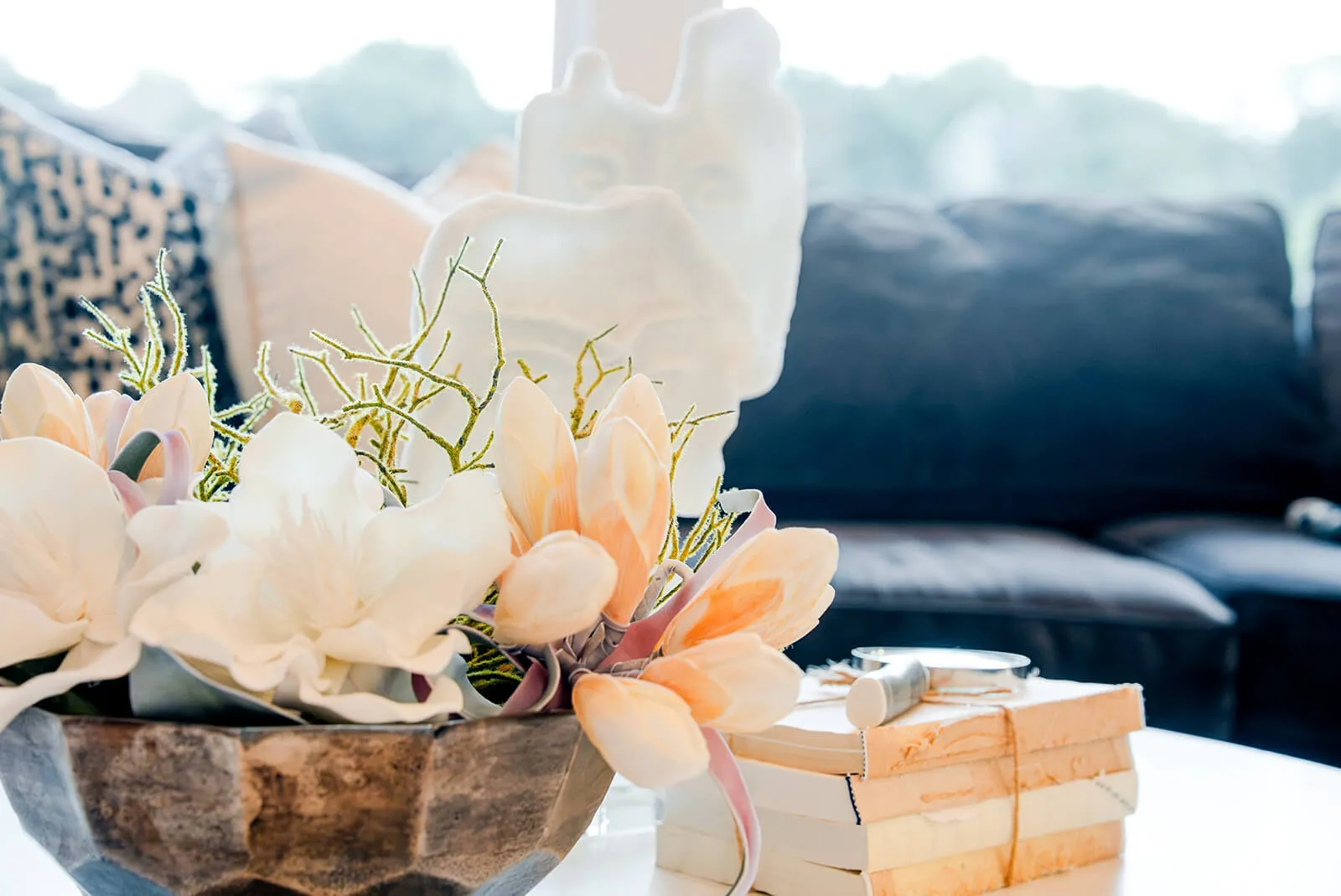 taylor-jane-project-43 Soft floral arrangement layered against abstract artwork in a refined neutral interior