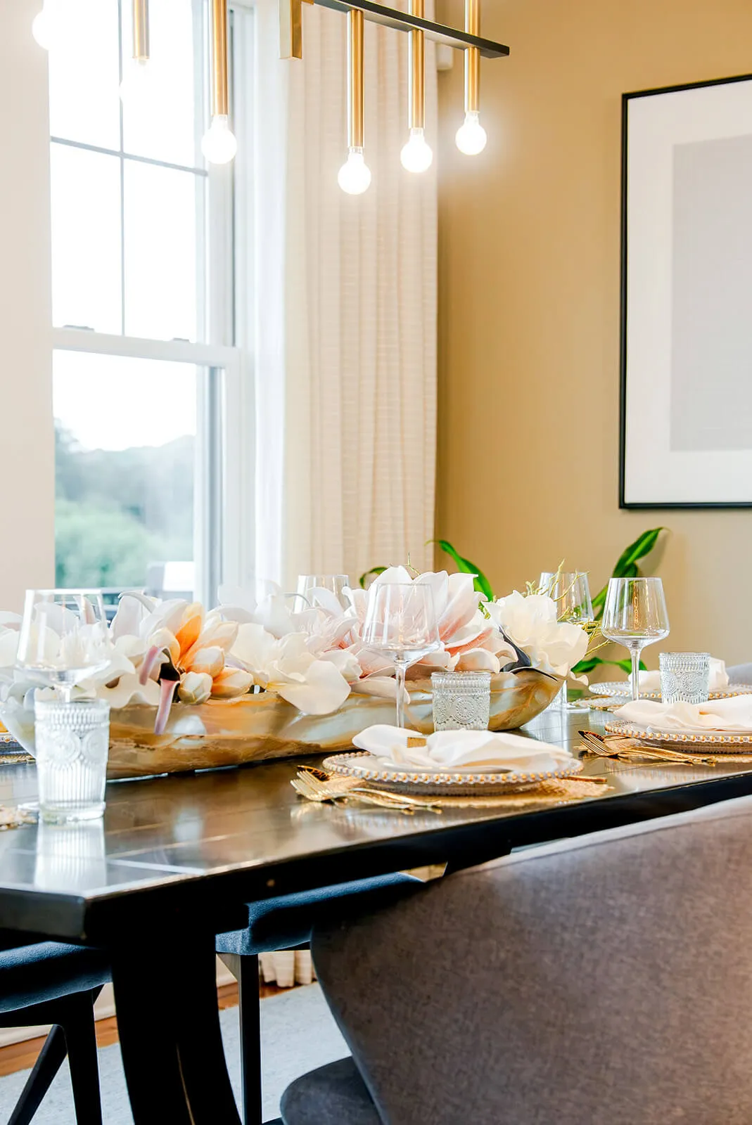 taylor-jane-project-44 Elegant table setting with fresh florals, glassware, and natural light from expansive windows