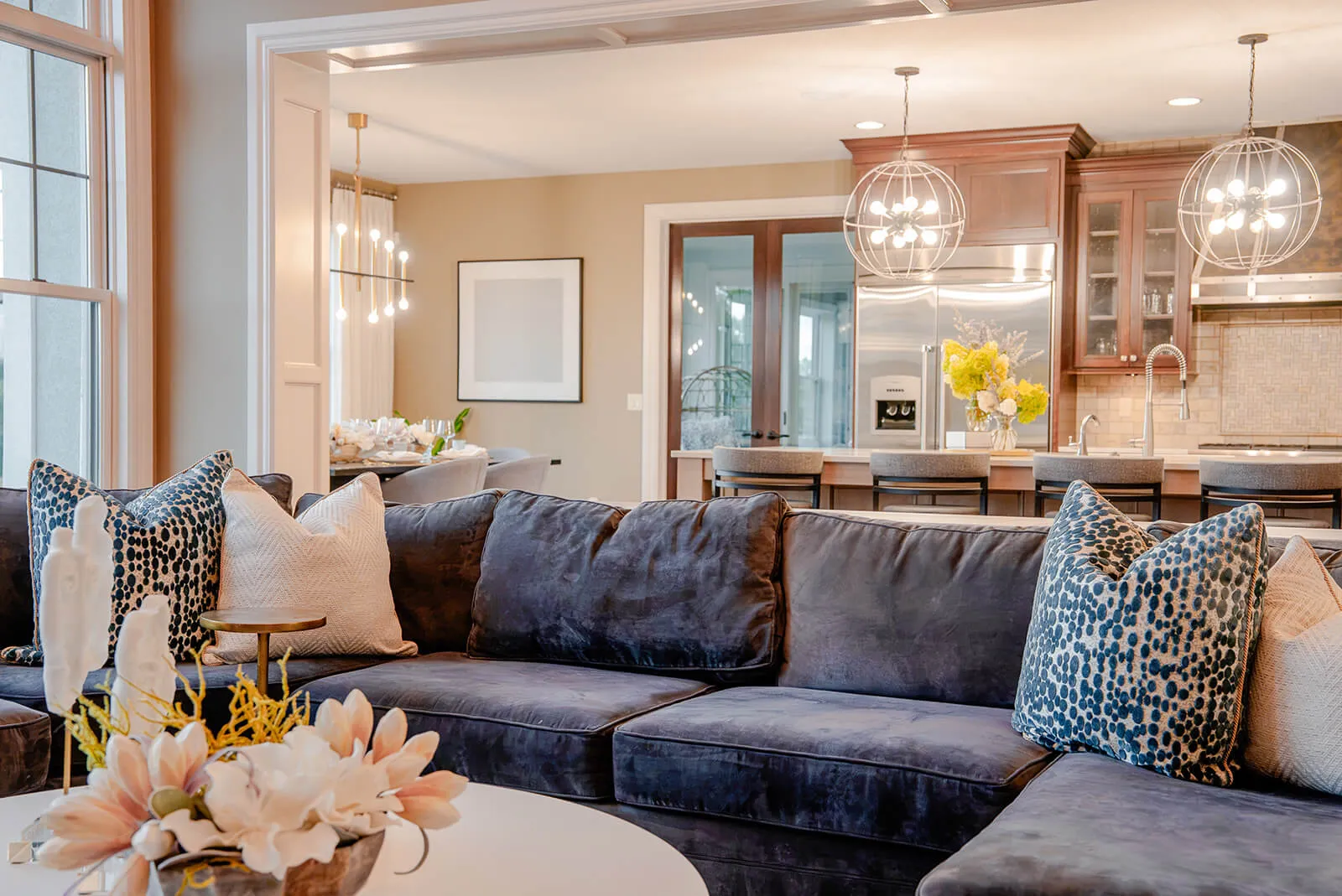 taylor-jane-project-47 Inviting living room with deep blue seating, natural wood accents, and a refined rustic aesthetic