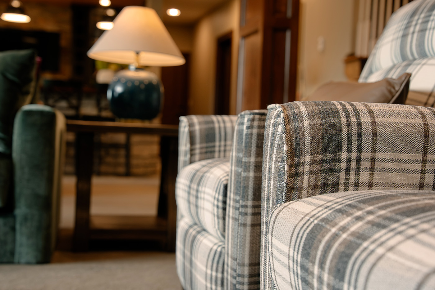 taylor-jane-project-48 Plaid upholstered chairs in a warm, inviting living room